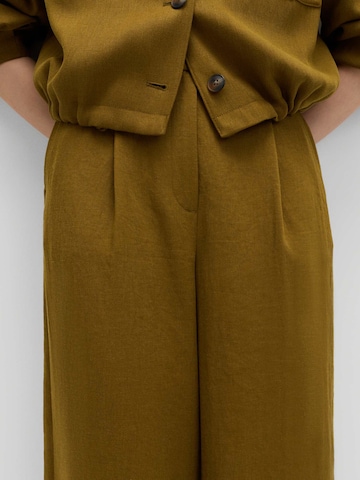 Wide leg Pantaloni con piega frontale di Marks & Spencer in verde