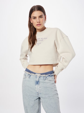 Calvin Klein Jeans Bluzka sportowa w kolorze beżowy: przód