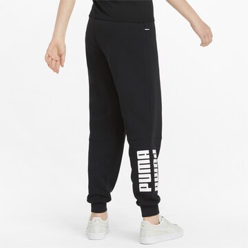 PUMA - Tapered Pantalón deportivo en negro