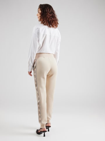 GUESS - Tapered Pantalón deportivo 'BRITNEY' en gris