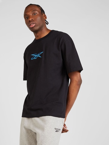 Reebok T-shirt 'UNIFORM' i svart: framsida