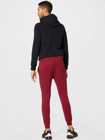 HOLLISTER - Tapered Calças em vermelho