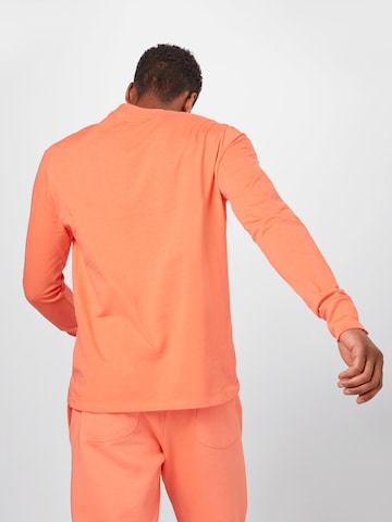 Maglietta 'Kelkid' di ABOUT YOU x Mero in arancione