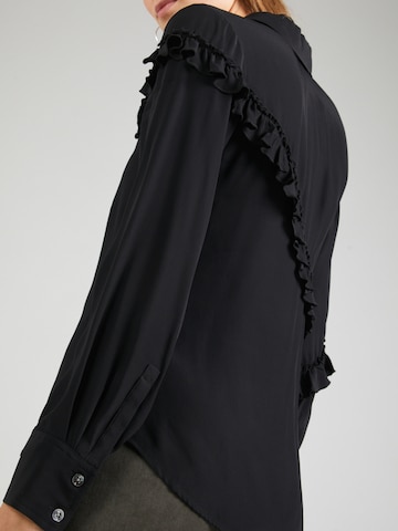 3.1 Phillip Lim - Blusa en negro