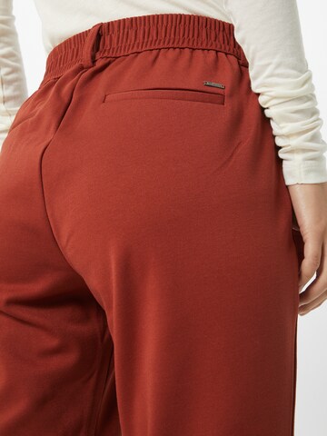 Tapered Pantaloni chino di TOM TAILOR DENIM in arancione