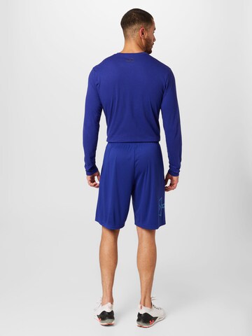 UNDER ARMOUR Loosefit Sportovní kalhoty – modrá