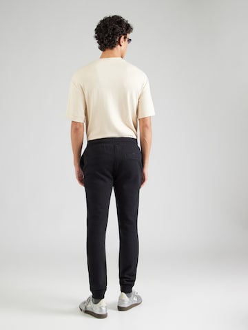 Tapered Pantaloni de la ELLESSE pe negru