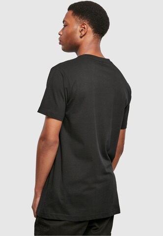 Mister Tee Regular Fit Paita 'Raised By The Streets' värissä musta