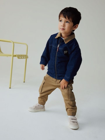 Next Jacke in Blau: Vorderseite