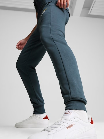 PUMA - Tapered Calças de desporto 'ESS+' em azul