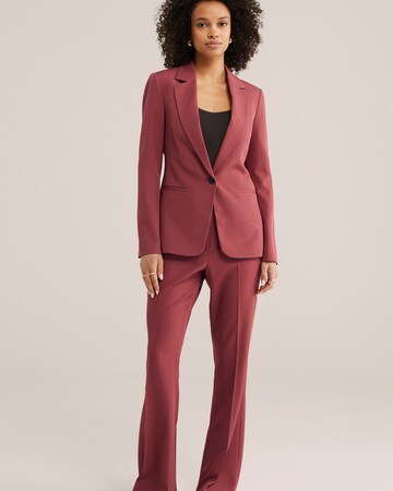 Flared Pantaloni con piega frontale di WE Fashion in rosso