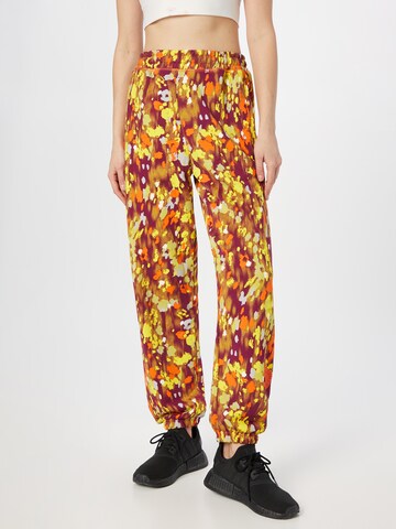 ADIDAS BY STELLA MCCARTNEY Tapered Workout Pants 'Floral Printed ' in Orange: front