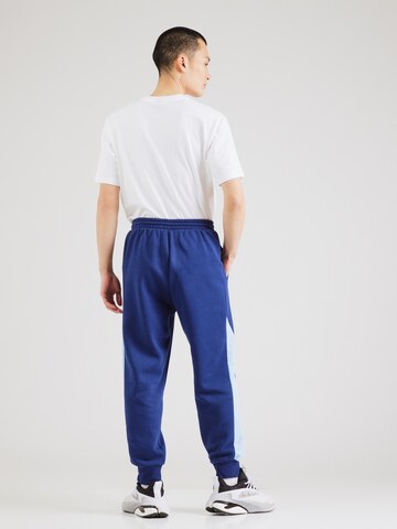 zils ADIDAS SPORTSWEAR Pakapēniski sašaurināts piegriezums Sporta bikses 'Ess'
