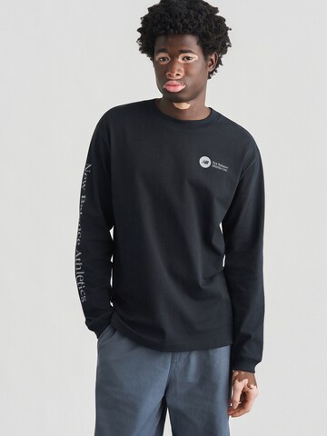 new balance T-shirt i svart