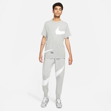 Nike Sportswear Tapered Pants 'Swoosh Tech' in Grey