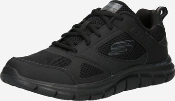 Baskets basses SKECHERS en noir : devant