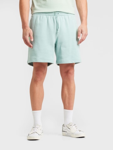 ADIDAS ORIGINALS Loose fit Trousers 'ESSENTIAL' in Green: front