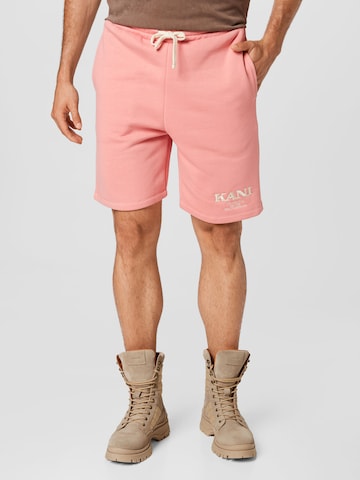 Karl Kani Regular Pants in Pink: front