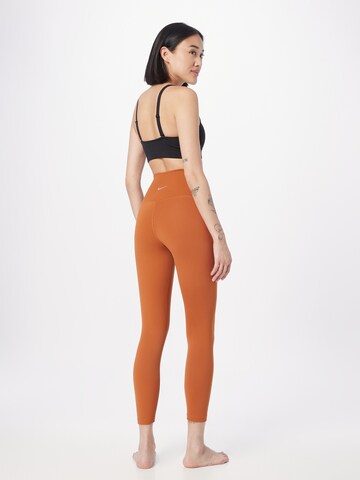 NIKE Skinny Workout Pants in Orange