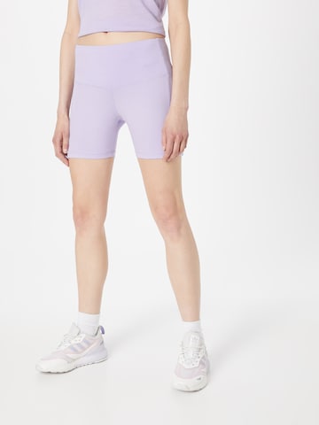 Skinny Pantalon de sport super.natural en violet : devant