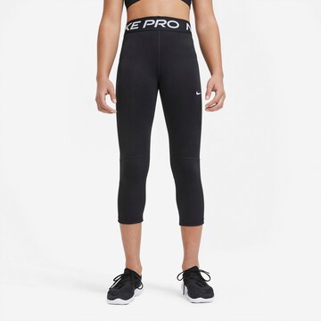 NIKE Skinny Workout Pants in Black: front