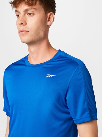 Reebok - Camisa funcionais em azul