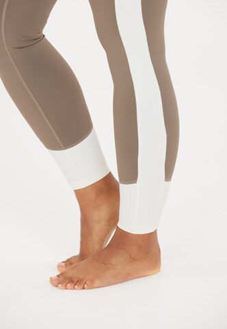Athlecia Skinny Sports trousers 'Lris' in Brown