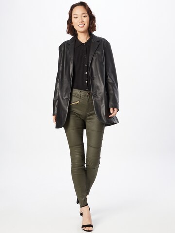 Skinny Jeans di River Island in verde