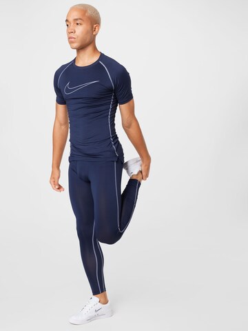 NIKE Skinny Sports trousers in Blue