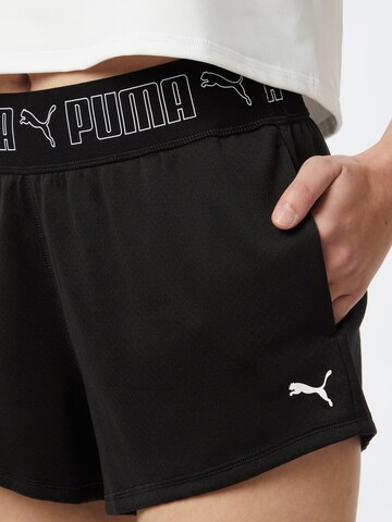 Regular Pantaloni sport de la PUMA pe negru