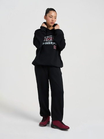 Effilé Pantalon AND1 en noir