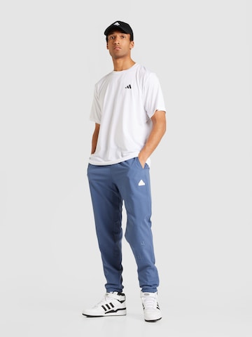 ADIDAS SPORTSWEAR Tapered Sportbyxa i blå