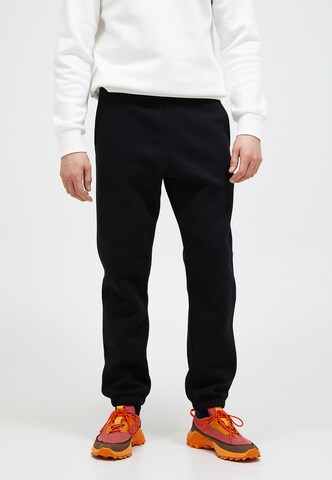 PEAK PERFORMANCE Regular Pants in Black: front