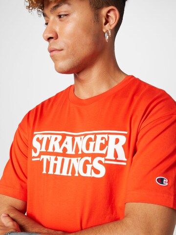Maglietta di Champion Authentic Athletic Apparel in arancione