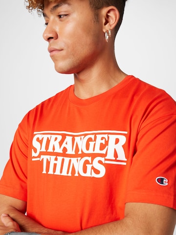 Champion Authentic Athletic Apparel T-Shirt in Orange