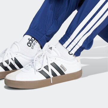 ADIDAS SPORTSWEAR Tapered Sports trousers in Blue