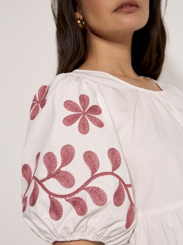 Apricot Floral Embroidered Peplum Top ' ' in Beige
