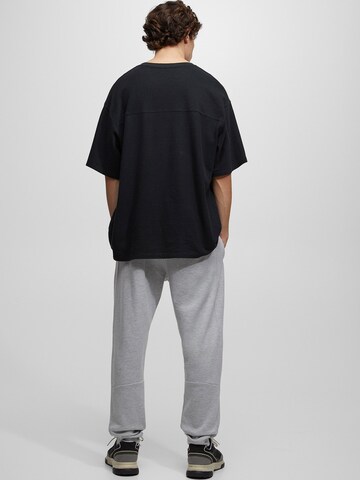 Tapered Pantaloni di Pull&Bear in grigio