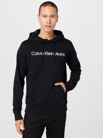 Sweat-shirt Calvin Klein Jeans en noir : devant