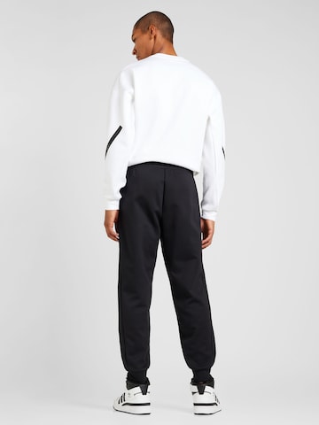 ADIDAS SPORTSWEAR Tapered Παντελόνι φόρμας 'Z.N.E.' σε μαύρο