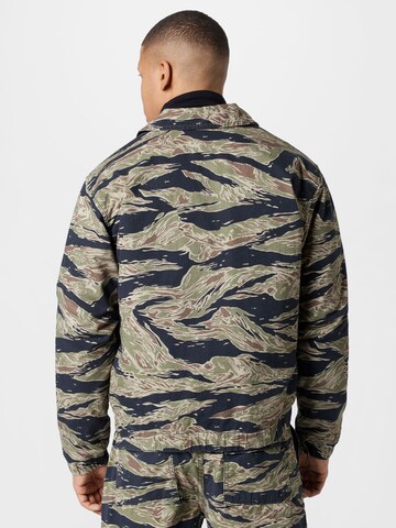 BDG Urban Outfitters Φθινοπωρινό και ανοιξιάτικο μπουφάν 'TIGER CAMO' σε πράσινο