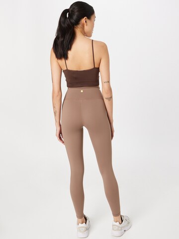 Skinny Pantalon de sport 'GABY' Athlecia en marron