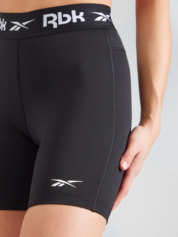 Reebok Skinny Sportnadrágok 'ID TRAIN' - fekete