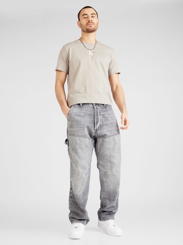 Calvin Klein Jeans Tričko - Sivá