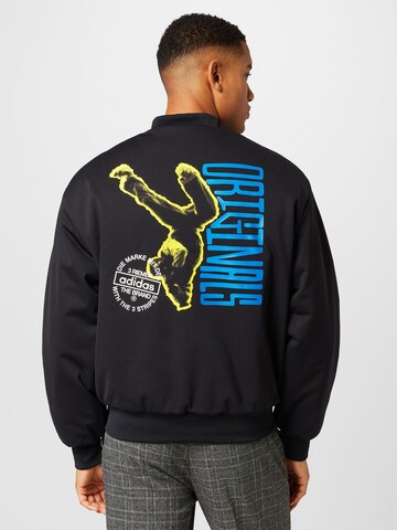 Veste mi-saison 'Graphics Unite ' ADIDAS ORIGINALS en noir