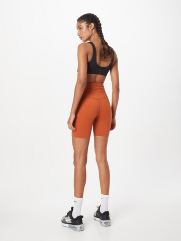 NIKE Skinny Sportovní kalhoty 'ONE' – oranžová