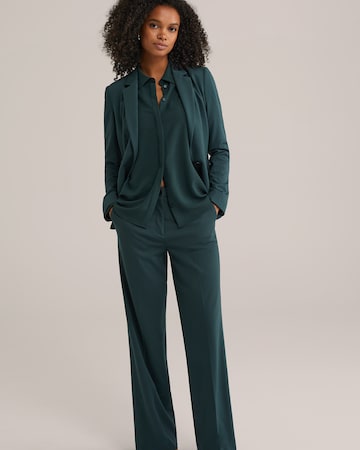 WE Fashion Loose fit Trousers with creases in Green