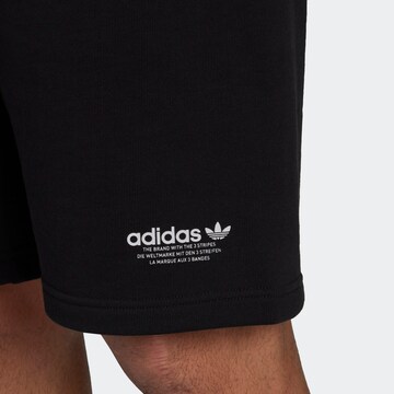 ADIDAS ORIGINALS Szabványos Nadrág 'Graphics United' - fekete