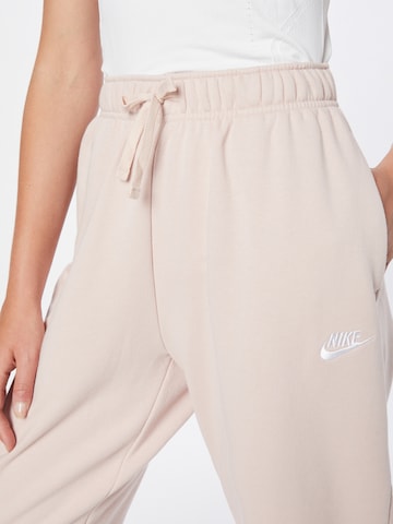 Nike Sportswear Lużny krój Spodnie w kolorze różowy