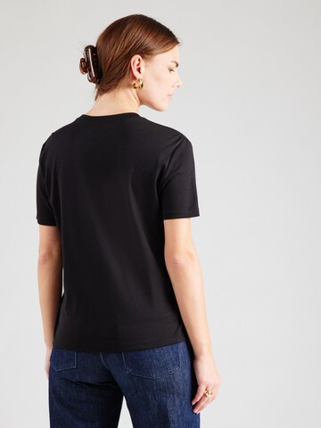 Calvin Klein Jeans - Camiseta 'HERO' en negro: atrás